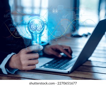 Artificial intelligence chat bot technology concept. Glow digital light bulb graphics with AI brain system inside, hold by business person. Chatbot intelligent digital customer service application.