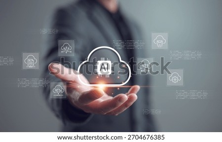 Artificial intelligence cloud computing concept. Businessman holding AI icon in cloud shape with virtual data network. Futuristic technology for data storage, processing, and innovation.