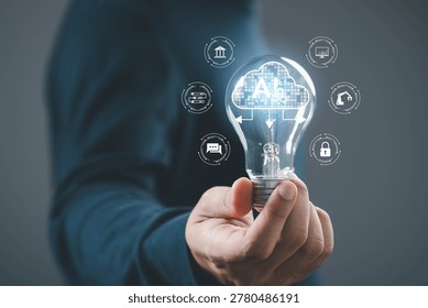 Artificial intelligence cloud concept with light bulb, hand holding smart AI system, data processing, machine learning, cloud computing, automation technology and digital transformation innovation