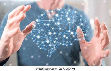Artificial intelligence concept between hands of a man in background