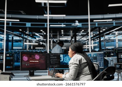 Artificial intelligence data center system administrator disturbed by virus breaching security. African american woman in AI server hub afraid by hacker attack stealing sensitive information.