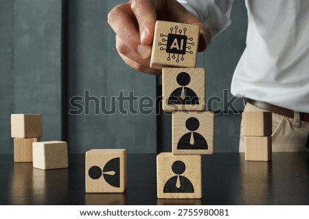 Artificial intelligence replacing workforce concept with wooden blocks showing AI symbol on top of human figures, automation, job displacement, technology impact on employment and business