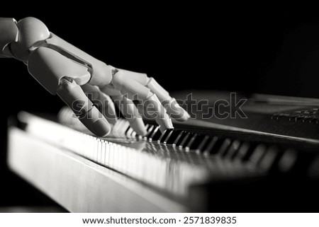 Artificial intelligence. Robot hand playing synthesizer on black background, closeup