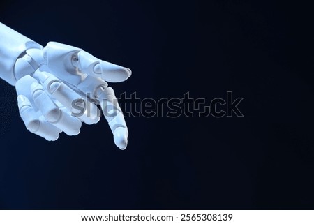 Artificial intelligence. Robot hand pointing at something on dark blue background, space for text