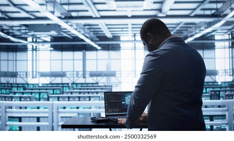 Artificial intelligence technology simulating human brain used by engineer in data center. Worker working on digital device with AI tech machine learning algorithms, camera B