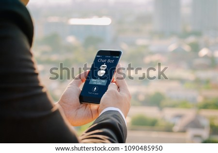 artificial intelligence,AI chat bot concept.close-up of Man hands holding mobile phone on blurred urban city as background
