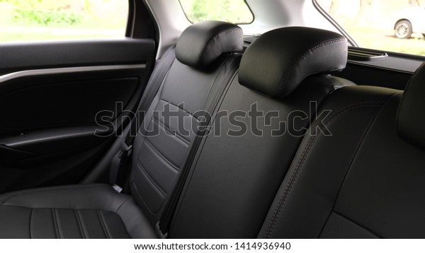 artificial leather rear seats in car. beautiful\
leather car interior design. luxury leather seats in the car. Black\
leather seat covers in the\
car.