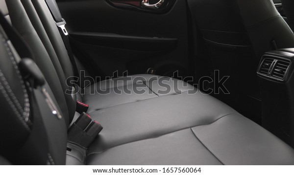 artificial leather rear seats in car. beautiful\
leather car interior design. luxury leather seats in the car. Black\
leather seat covers in the\
car.