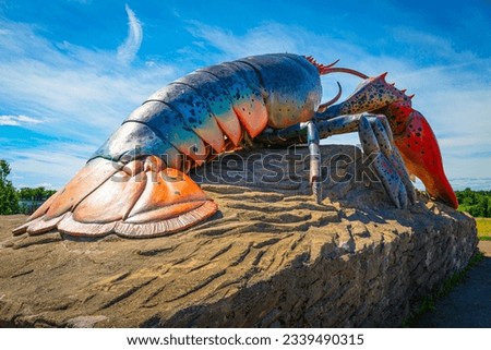Artificial lobster on the rock in the beach