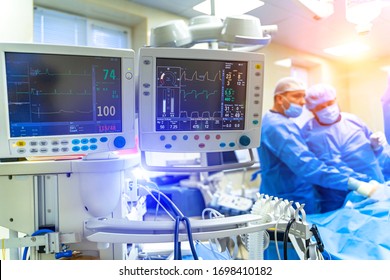 Artificial lung ventilation monitor in the intensive care unit. Nurse with medical equipment. Ventilation of the lungs with oxygen. COVID-19 and coronavirus identification. Pandemic. - Shutterstock ID 1698410182
