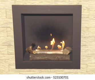 Artificial Natural Gas Fireplace With A Natural Stone In The Living Room. Vintage Style.