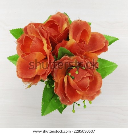 Artificial Orange Flower with White Background