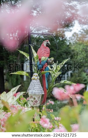 An artificial parrot bird in the garden