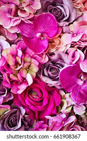 Artificial pink flowers background 