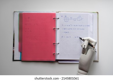 artificial robotic arm write down some notes with pen
