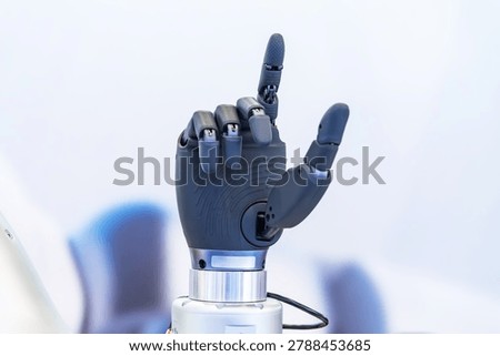 Artificial robotic hand at the presentation of robotics.Creation of artificial intelligence