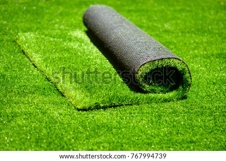 artificial rolled green grass; closeup
