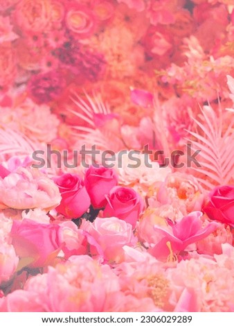 Artificial rose and carnation flowers bouquet for valentines or wedding day background. Pink floral wall decoration.