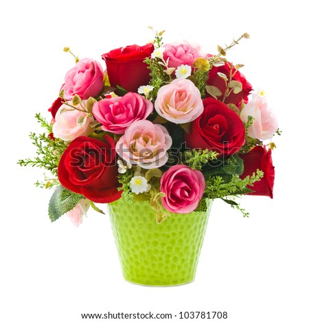 Artificial rose flowers in green vase on white background