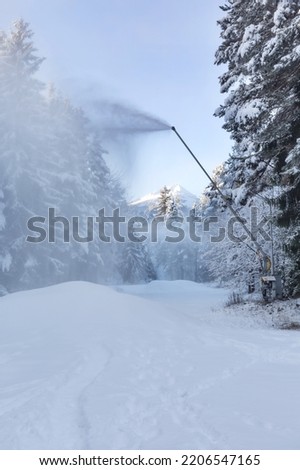 Artificial Snow Machine Making Snowflakes at Slope in Ski Resort Bansko, Bulgaria. Snowmaking Cannon