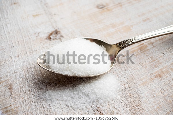Artificial Sweeteners and Sugar\
Substitutes in metal spoon. Natural and synthetic sugarfree food\
additive:  sorbitol, fructose, honey, Sucralose,\
Aspartame