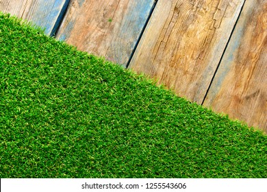 Artificial turf on a wooden weathered terrace