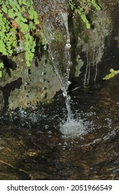 Artificial Waterfall In A Small Fish Pond