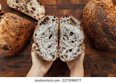 Artisan bread. Homemade Sourdough bread with olives. Top view showing cut bread on cutting board - Powered by Shutterstock