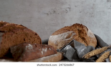 Artisan bread loaves on a rustic table, a warm bakery scene. - Powered by Shutterstock