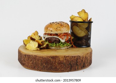 Artisan Burger With French Fries Meat And Cheese On Wood