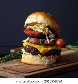 Artisan Burger With Meat And Cheese Bread On Wood