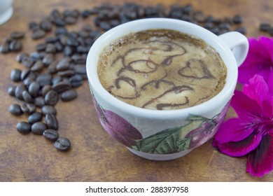 Artisan Coffee On A Brown Wooden Table With Coffee Beans Scattered
