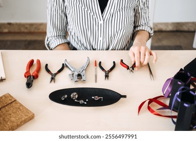 Artisan crafting workspace with jewelry-making tools. Highlighting professional craftsmanship and the essentials of handmade creativity. - Powered by Shutterstock