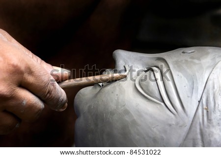An artisan creates the head of a goddess  festival in Kumartuli,
Calcutta, India