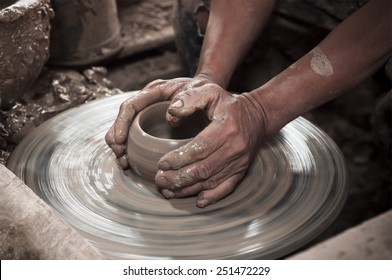 Artisan Hands Making Clay Pot
