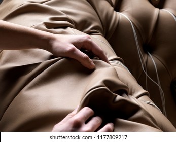artisan hands touching leather
