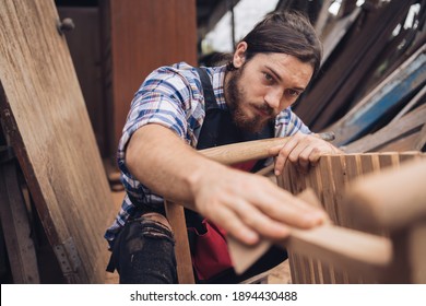 Artisan man
Small factory industry, handicraft manufacturer, furniture professional in woodworking. Craftman working workshop maker construction.