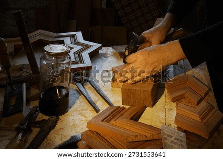 Artisan Meticulously Setting Up Decorative Forms On Weathered Rustic Wooden Bench For Display