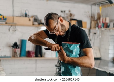 Artisan sculptor artist creates work of art in his workshop - Powered by Shutterstock