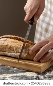 Artisan sliced bread in rustic style, arranged neatly on a dark, textured surface that adds a contrast highlighting the bread's crust and crumb textures vividly.