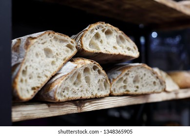 Artisan Sourdough Bread On The Wooden Shelf In The Bakery. Selective Focus.