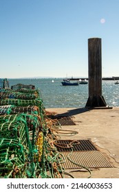 Artisanal fishing traps for octopus, lobsters and crabs in the fishing port of, fishing boats in the sea water, Cascais, Portugal