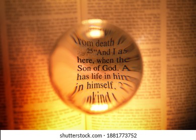 Artisic view of bible verse using a magnifying ball. Highlighting Son of God