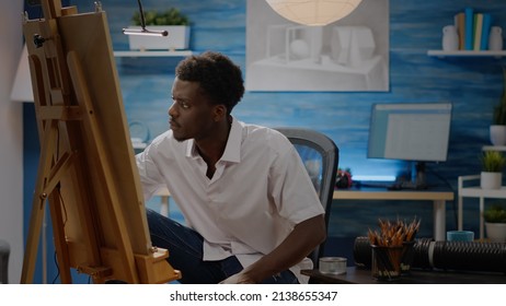 Artist Of African American Ethnicity Working On Drawing Of Vase At Art Studio. Black Young Adult Using Pencil And Canvas On Easel For Creative Masterpiece. Person With Fine Art Project