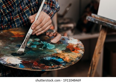 The artist in the art class of the school as a drawing course. Discounts on products for artists. Easel for still lifes. - Shutterstock ID 1911048469