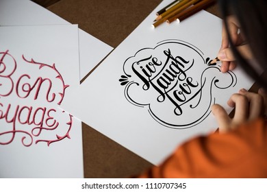 An artist creating hand lettering artwork - Powered by Shutterstock