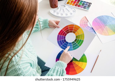 Artist or designer working with color wheel and color samples - Powered by Shutterstock