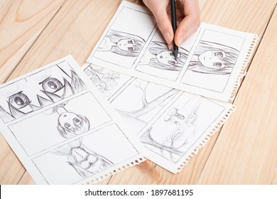 Artist drawing an anime comic book in a studio. - Shutterstock ID 1897681195