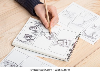 Artist Drawing An Anime Comic Book In A Studio.