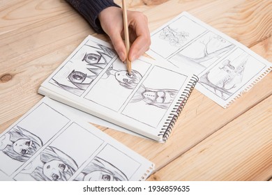 Artist Drawing An Anime Comic Book In A Studio.